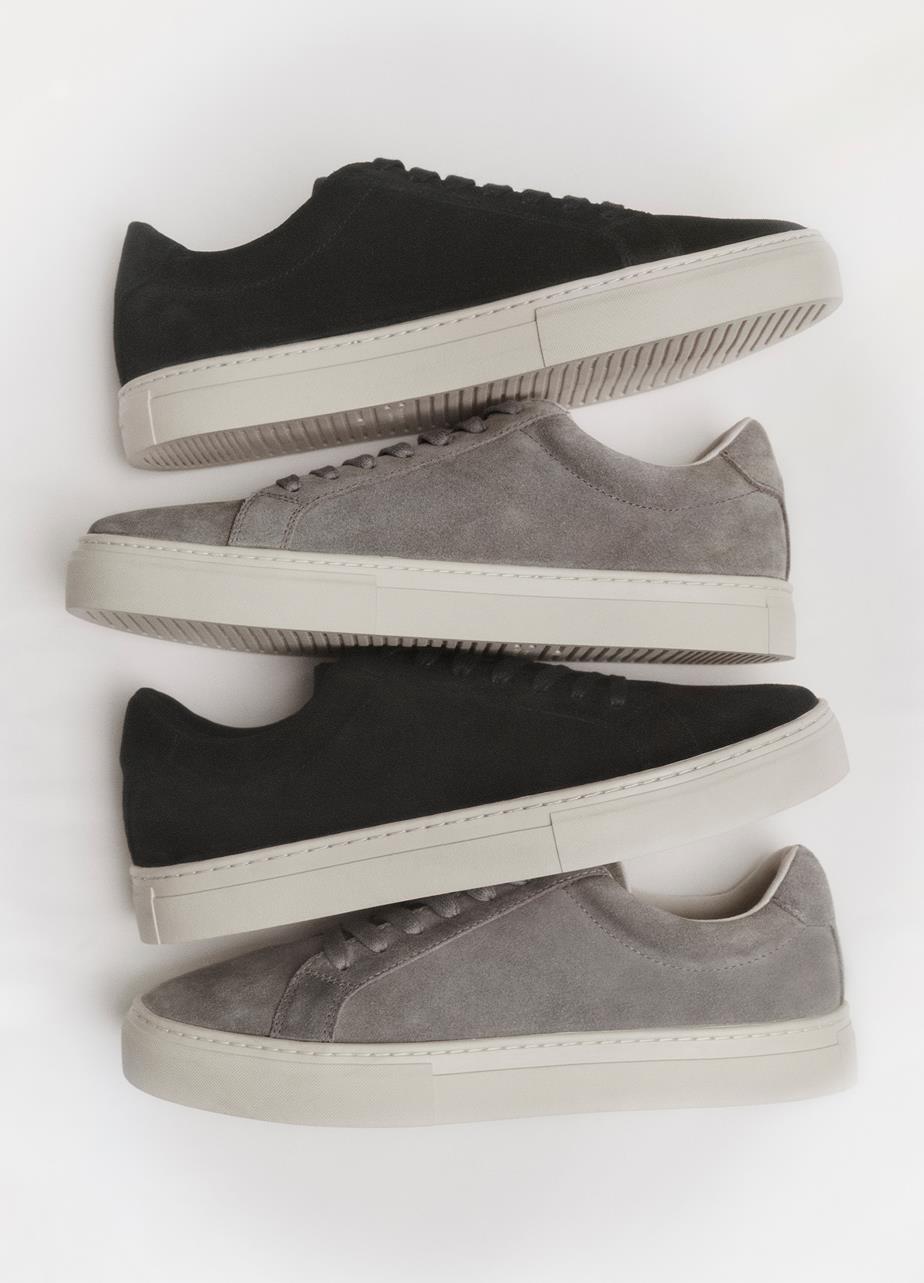 Two pairs of Paul 2.0 Sneakers displayed from above: one pair in dark blue suede and one in light gray suede