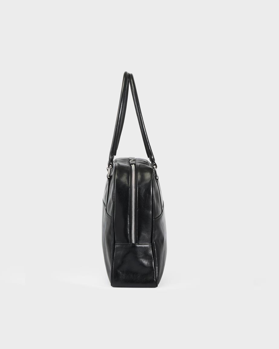 Nomi sac Noir, Cuir
